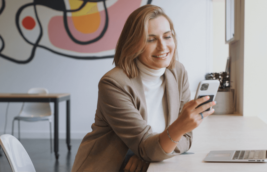 Online therapist talking with clients on her smartphone.